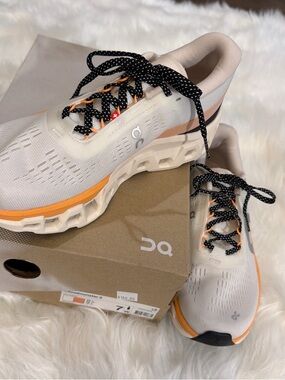 On Running Women's Cloudmonster Running Shoes — Cream with Orange and Black
